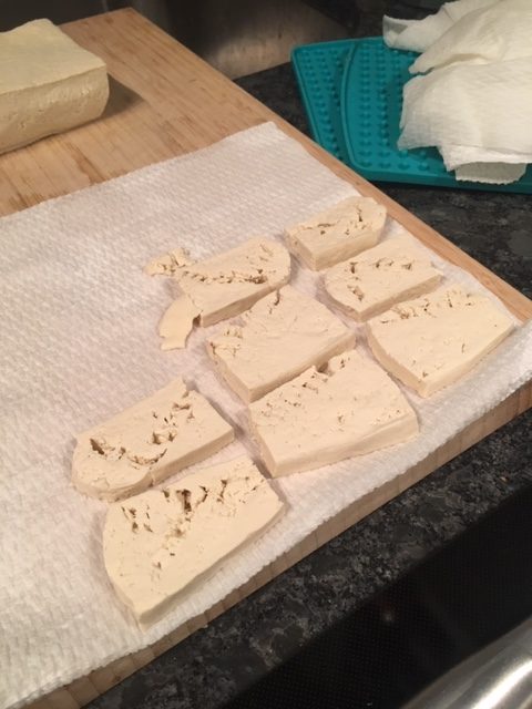 How to cook perfect tofu every time - Lay the slices out on paper towels to press them again