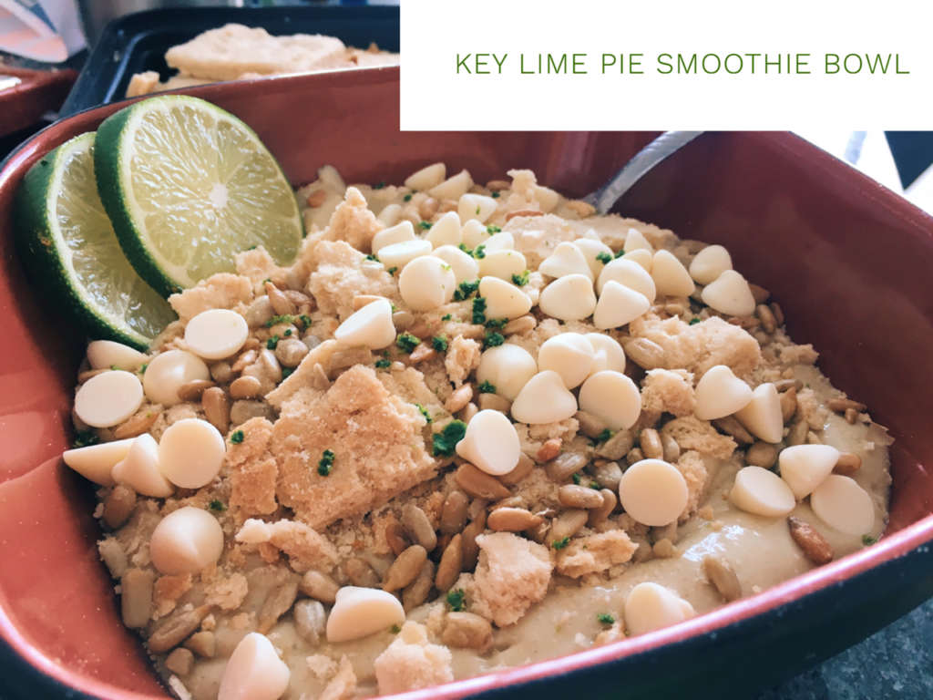 Picture of a smoothie bowl with lime flavor, topped with graham crackers, sun flower seeds, and white chocolate chips.